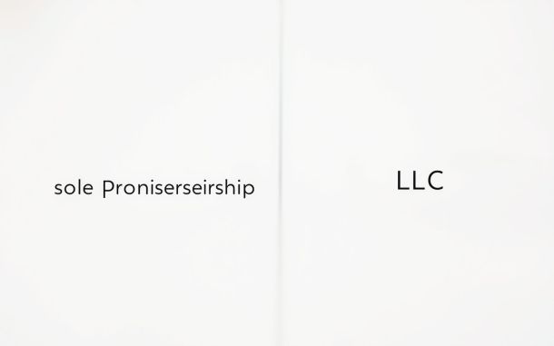 Abstract image showing benefits of forming an LLC vs sole proprietorship with two diverging paths representing business structure choices.