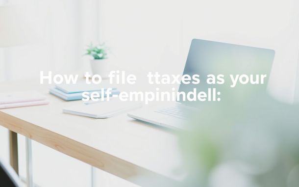 Self-employed individual's workspace with laptop and tax planning materials.