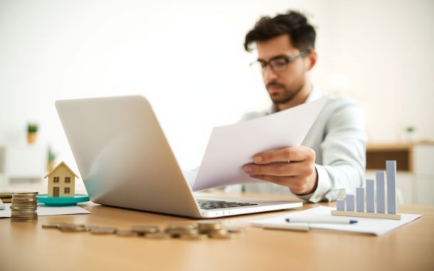 Small business owner reviewing loan options, symbolizing financial growth and opportunity.