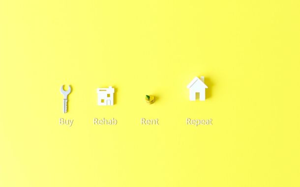 Symbolic representation of the BRRRR method real estate explained steps.