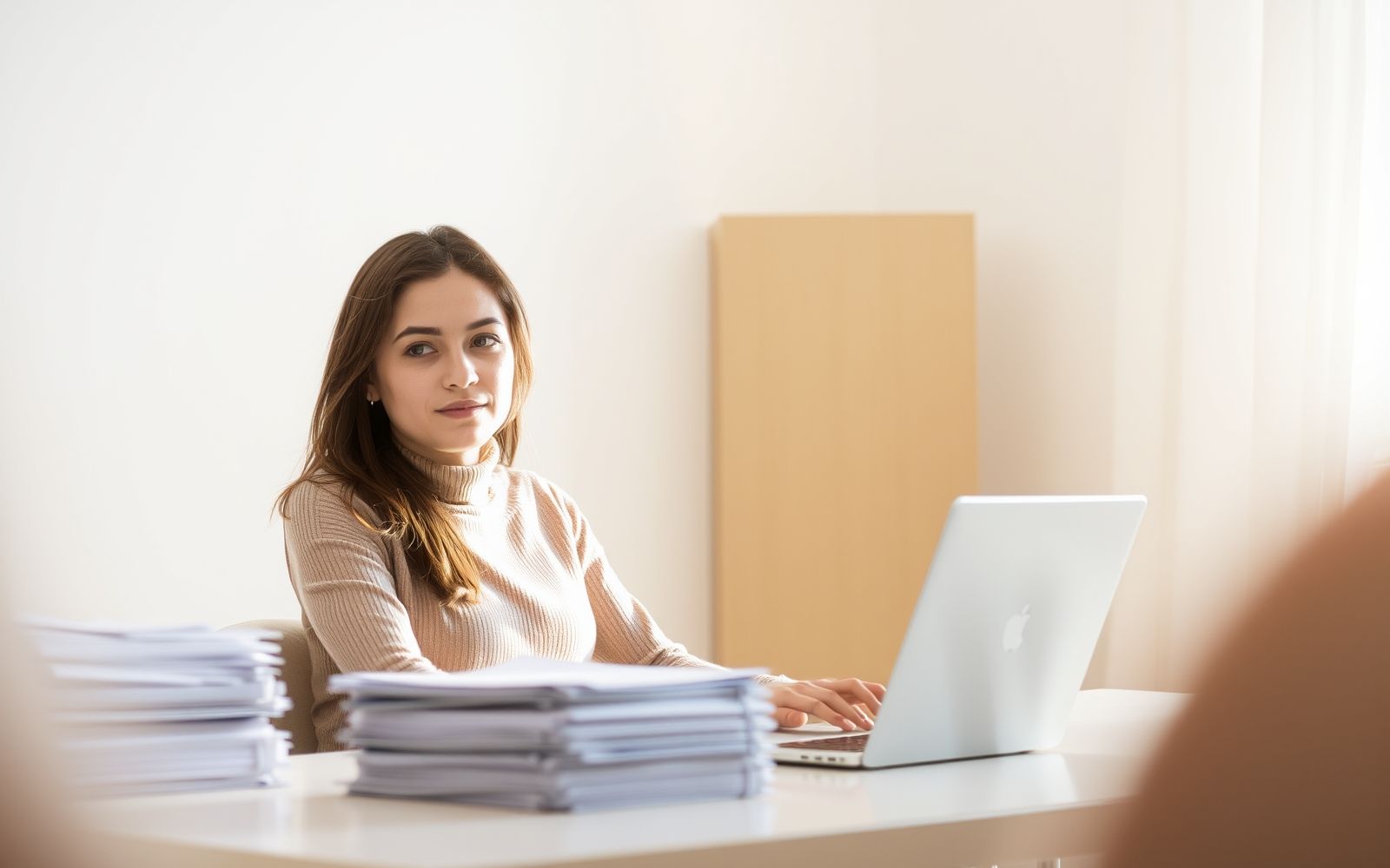Person calmly organizing documents for IRS audit help.